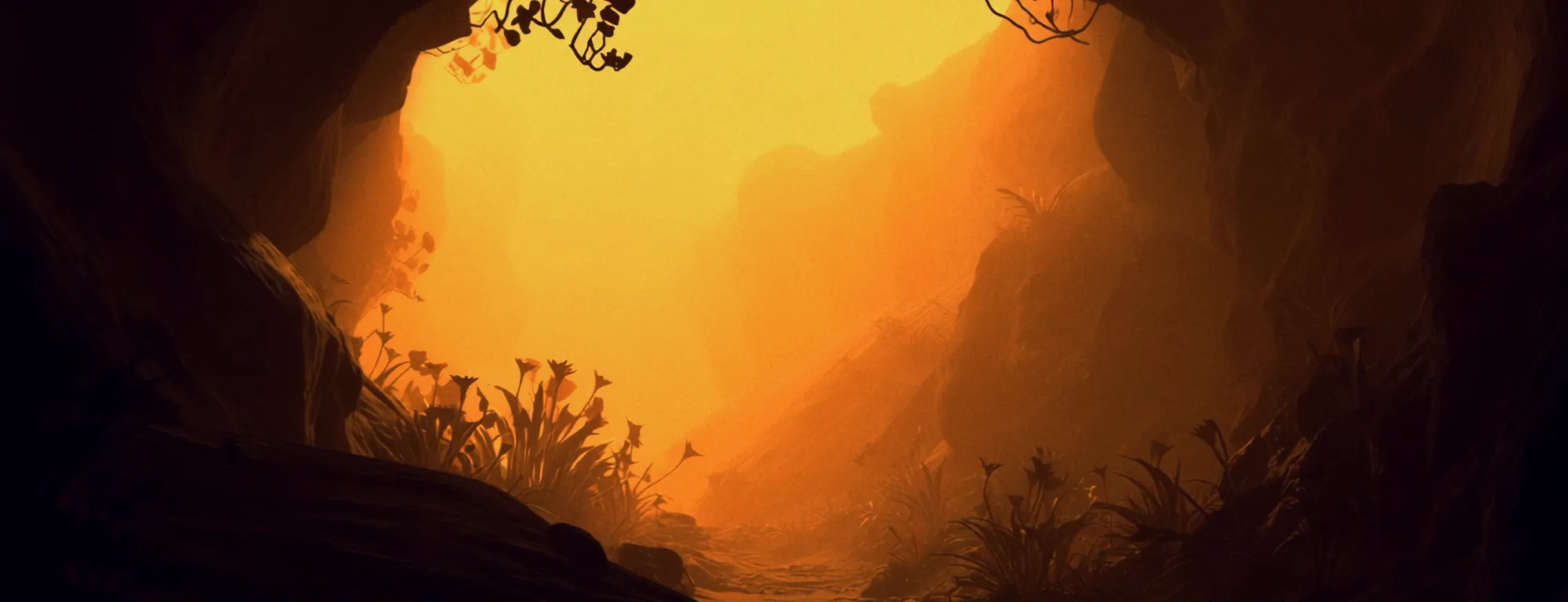 Screen content: golden light through a desert cave