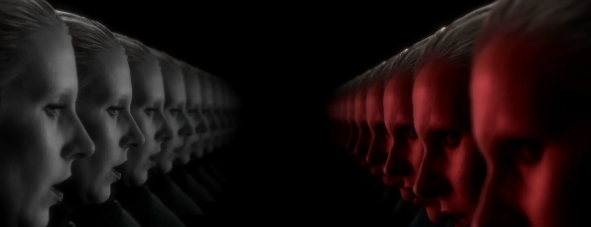 Screen content: rows of grey faces facing rows of red faces