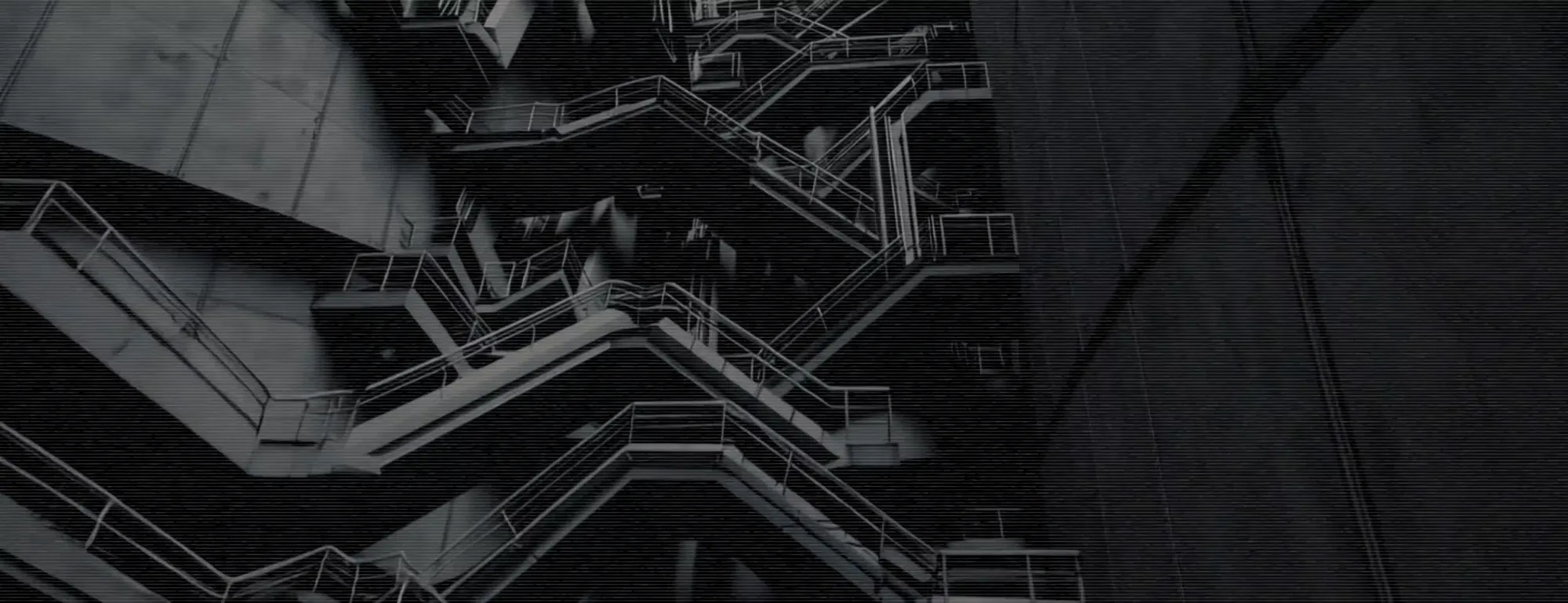Screen content: brutalist concrete stairwells